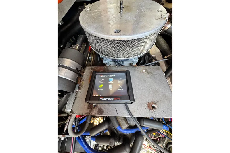 Slide: The Image of Engine compartment of a 1998 Luhrs Tournament 320 Convertible with Sniper EFI system. - 28