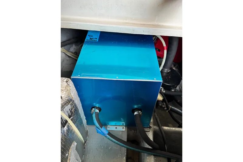 Slide: The Image of Engine compartment of 1998 Luhrs Tournament 320 Convertible with blue machinery. - 31