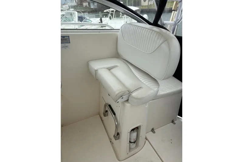 Slide: The Image of 2008 Seaswirl Striper 2901 Walkaround O/B boat interior with white cushioned seating. - 3