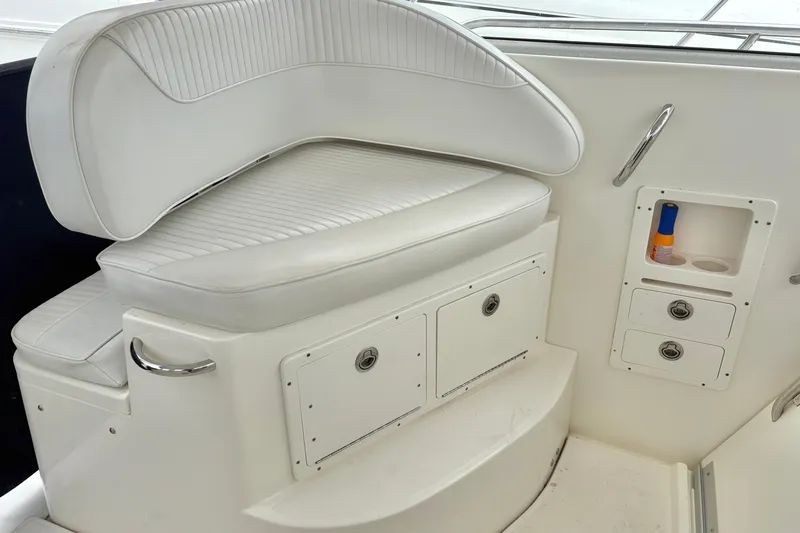 Slide: The Image of 2008 Seaswirl Striper 2901 Walkaround O/B boat interior with white seating and storage compartments. - 4