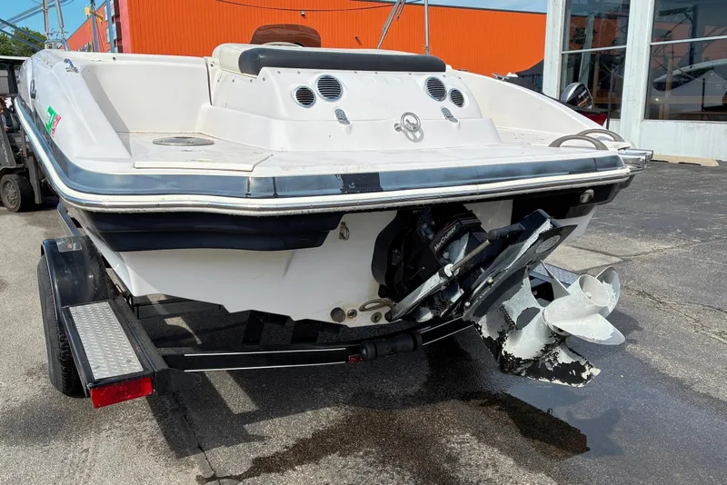 Slide: The Image of Rear view of a 2006 Tahoe 195 I/O boat on a trailer. - 1
