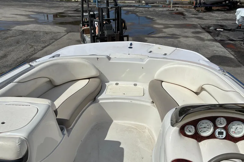 Slide: The Image of 2006 Tahoe 195 I/O boat interior with white seating and dashboard gauges. - 3