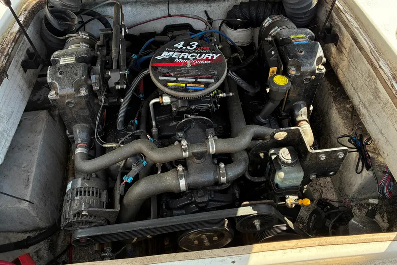 Slide: The Image of Engine compartment of a 2006 Tahoe 195 I/O boat with a Mercury MerCruiser 4.3 engine. - 7