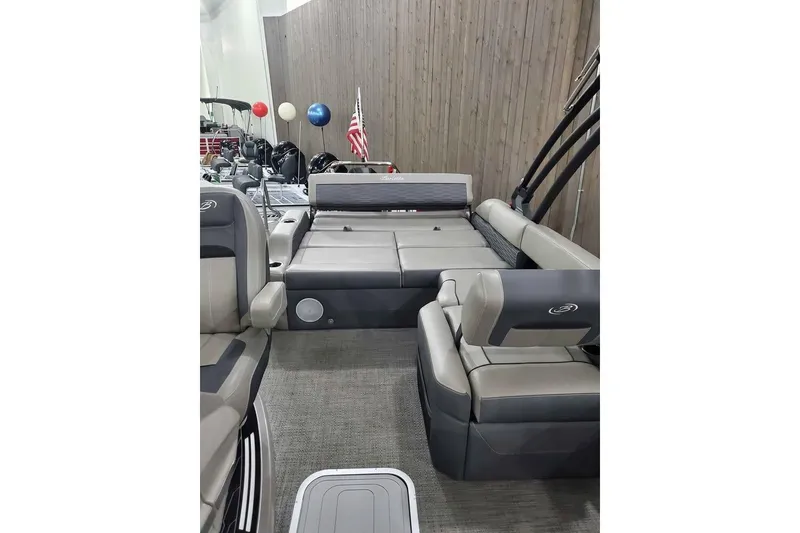 Slide: The Image of 2024 Barletta Corsa 23UA pontoon boat interior with plush seating and modern design. - 4