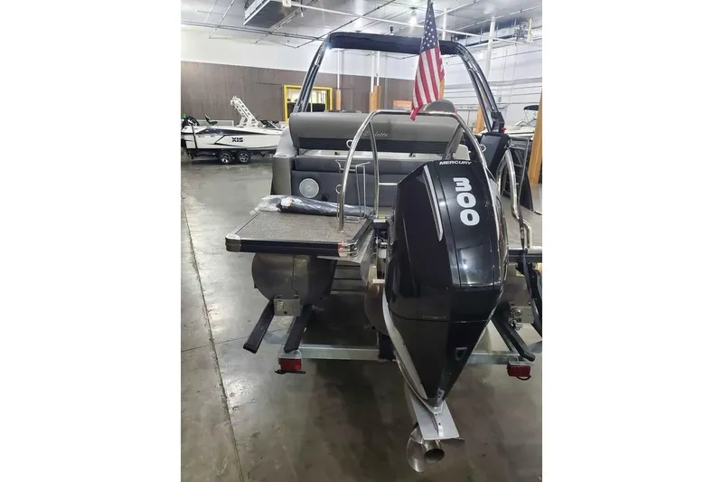 Slide: The Image of 2024 Barletta Corsa 23UA boat with Mercury 300 engine in showroom. - 5
