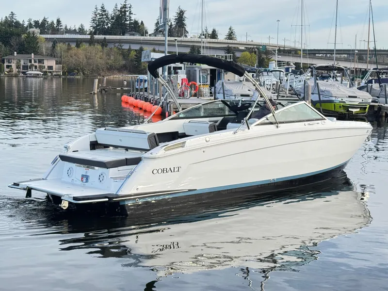 Slide: The Image of 2023 Cobalt R8 boat docked on calm water, featuring sleek design and modern amenities. - 20