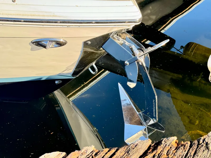 Slide: The Image of 2023 Cobalt R8 boat with shiny anchor reflected in water. - 38