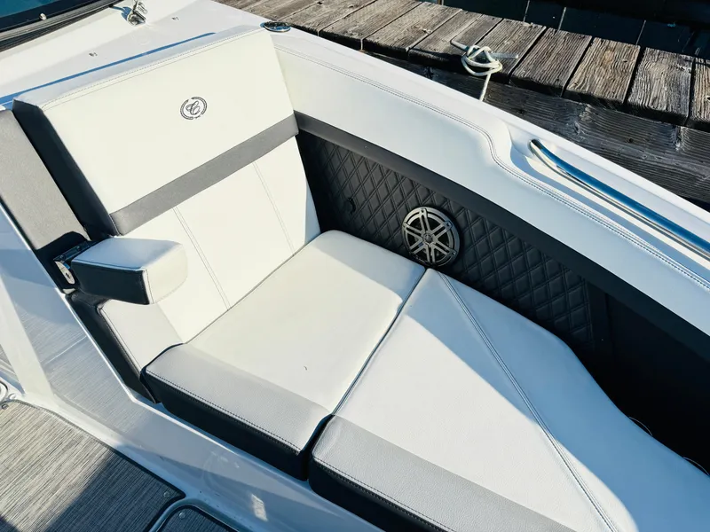 Slide: The Image of 2023 Cobalt R8 boat interior with white cushioned seating and speaker detail. - 42