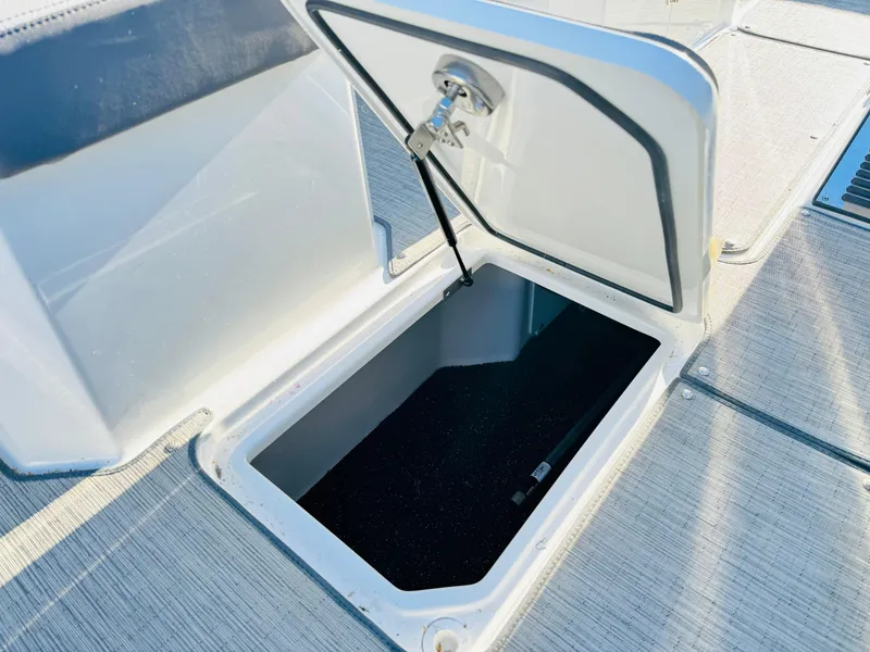 Slide: The Image of Open storage compartment on 2023 Cobalt R8 boat deck. - 46