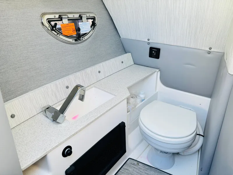 Slide: The Image of 2023 Cobalt R8 boat bathroom interior with sink and toilet. - 5