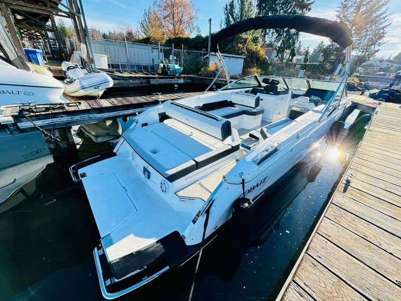 Slide: The Image of 2023 Cobalt R8 boat docked, featuring sleek design and spacious seating. - 8