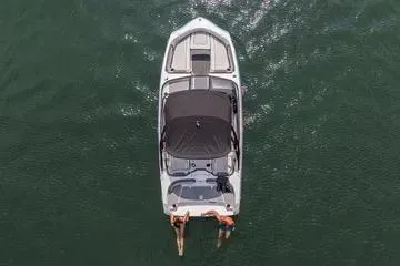 Slide: The Image of 2026 Yamaha Boats AR190 on water, aerial view, two people swimming at stern. - 15