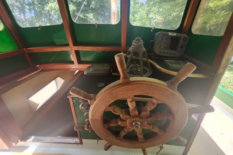 Slide: The Image of Wooden helm of 1995 Rover Marine Lines Bonny Rover boat, with navigation equipment. - 13