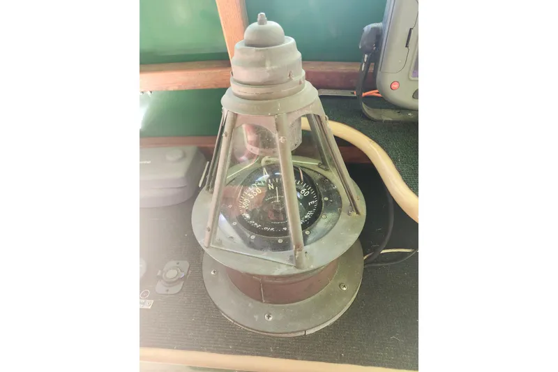 Slide: The Image of Vintage marine compass on a 1995 Rover Marine Lines Bonny Rover boat. - 15
