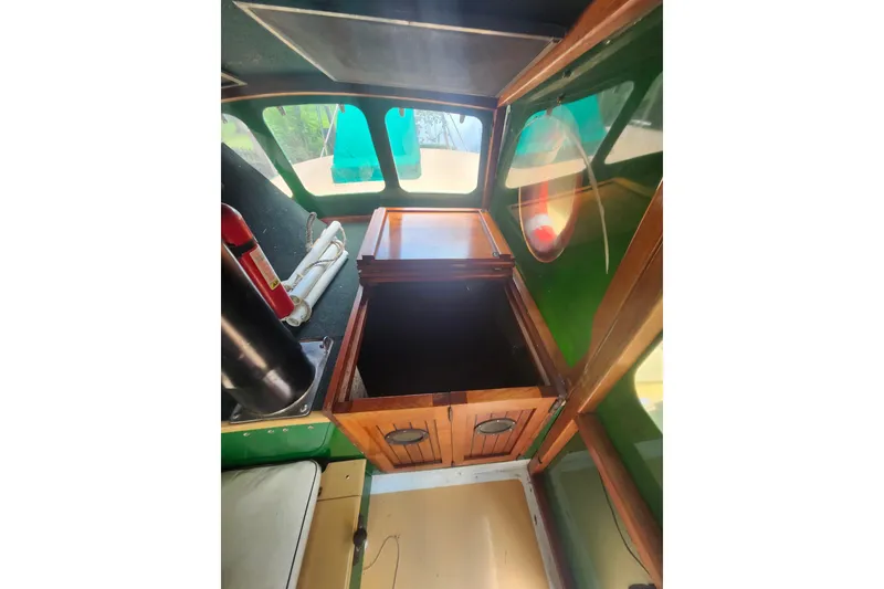 Slide: The Image of Interior of 1995 Rover Marine Lines Bonny Rover boat with wooden storage compartment. - 17
