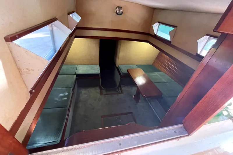 Slide: The Image of Interior of 1995 Rover Marine Lines Bonny Rover boat with seating and table. - 27