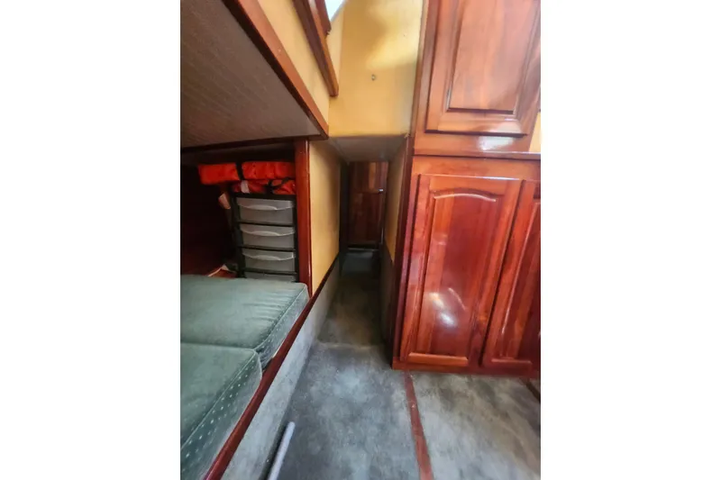 Slide: The Image of Interior of 1995 Rover Marine Lines Bonny Rover with wooden cabinets and seating area. - 33