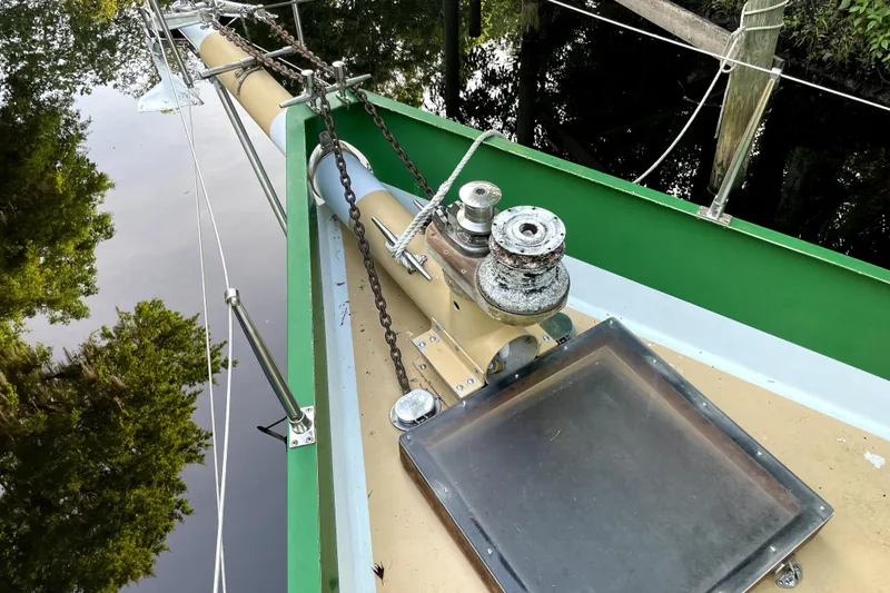 Slide: The Image of Bow of 1995 Bonny Rover sailboat with winch and green trim. - 34