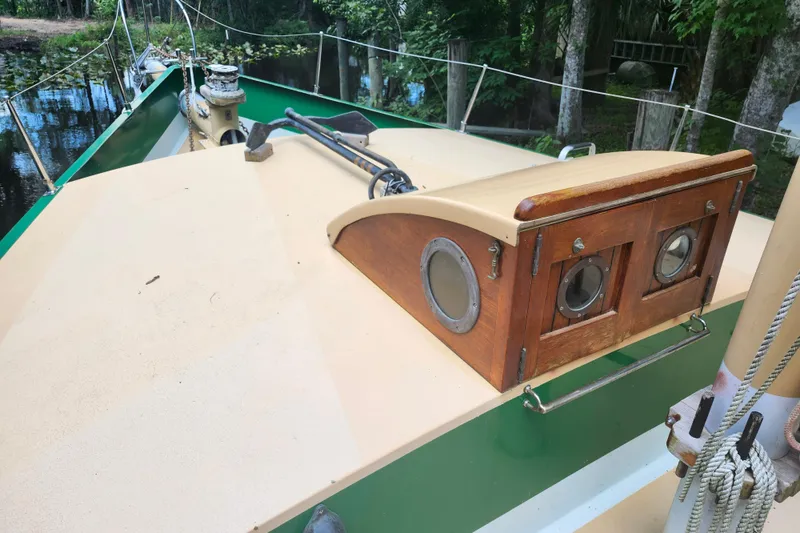 Slide: The Image of 1995 Rover Marine Lines Bonny Rover boat deck with wooden cabin and portholes. - 36