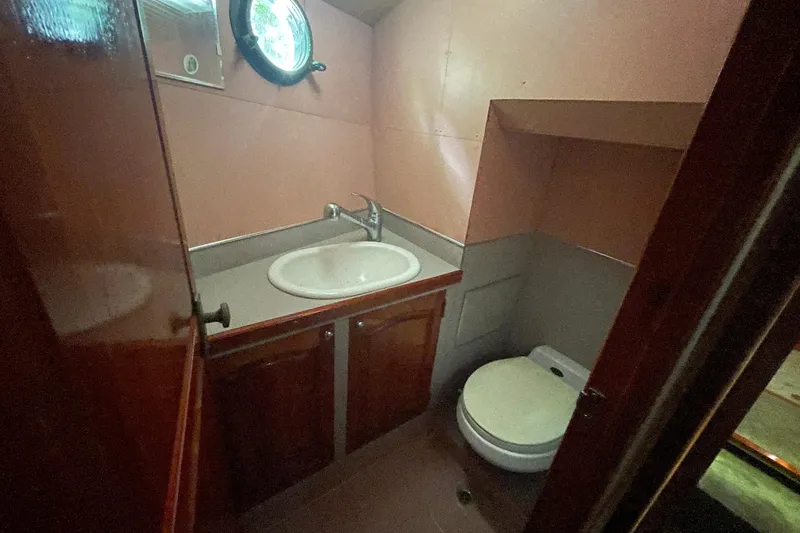 Slide: The Image of Compact bathroom in 1995 Rover Marine Lines Bonny Rover boat, featuring sink and toilet. - 42