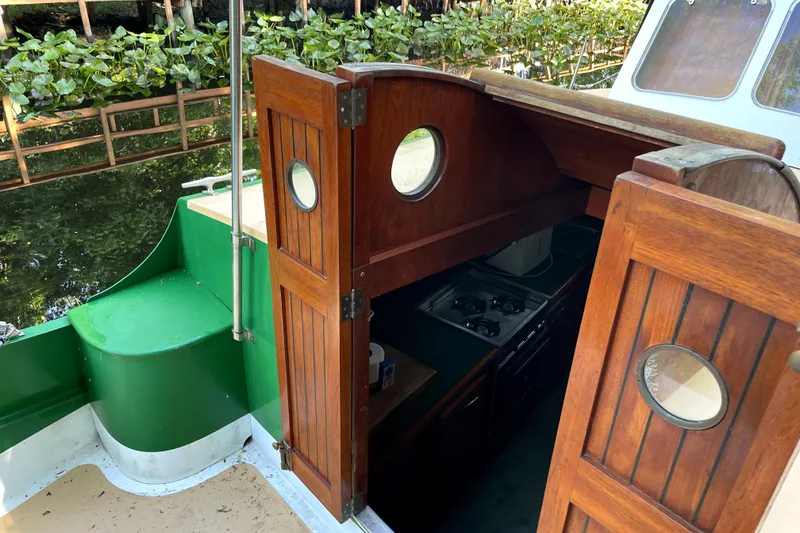 Slide: The Image of Wooden cabin entrance of 1995 Rover Marine Lines Bonny Rover boat. - 43