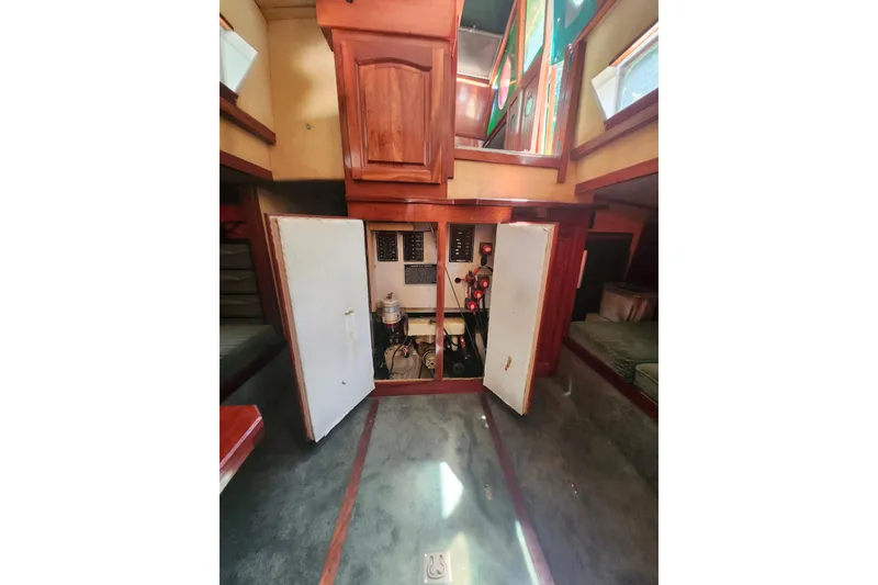 Slide: The Image of Interior of 1995 Rover Marine Lines Bonny Rover boat with open cabinet and equipment. - 48