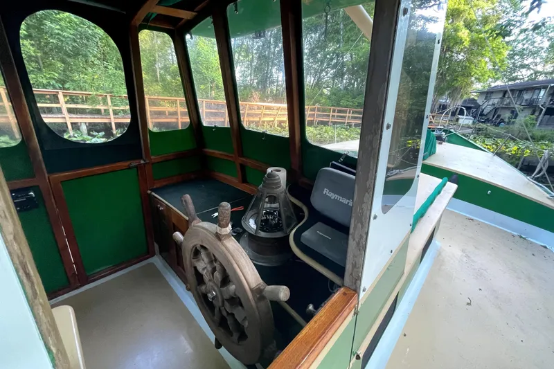 Slide: The Image of Interior of 1995 Rover Marine Lines Bonny Rover boat with wooden steering wheel. - 6