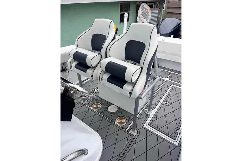 Slide: The Image of Luxury seating on 2003 Sports Fisher 340 boat, featuring sleek design and modern upholstery. - 4
