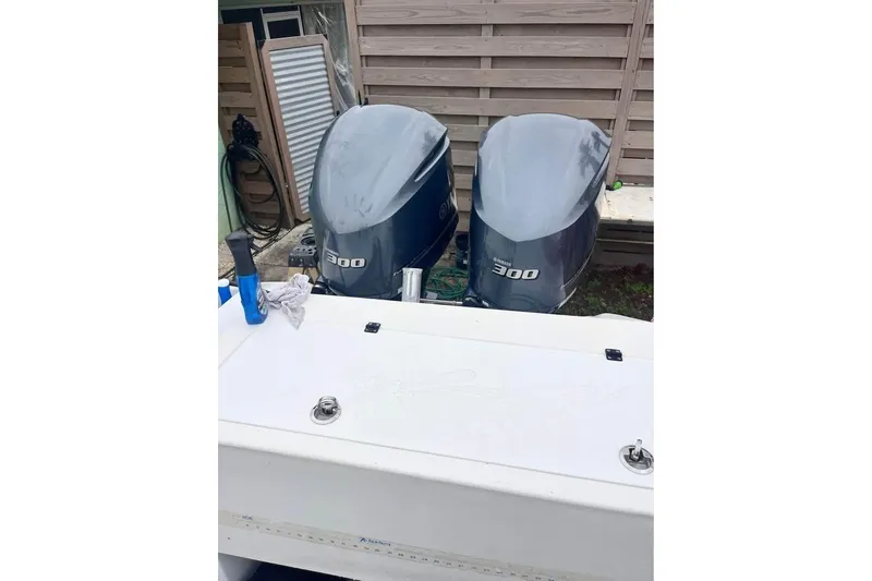 Slide: The Image of Twin Yamaha 300 outboard engines on a 2003 Sports Fisher 340 boat. - 5
