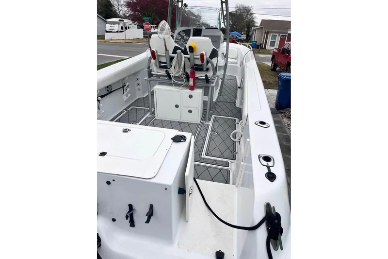 Slide: The Image of 2003 Sports Fisher 340 boat interior with seating and storage compartments. - 6