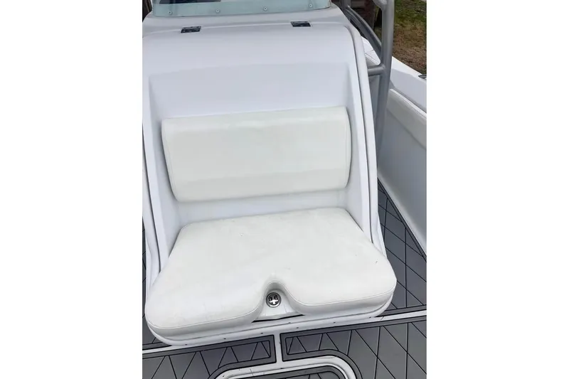 Slide: The Image of White cushioned seat on 2003 Sports Fisher 340 boat, featuring sleek design and modern flooring. - 8