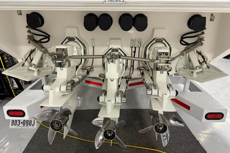 Slide: The Image of Rear view of 2000 Fountain 47 Lightning boat with triple propeller drives. - 10