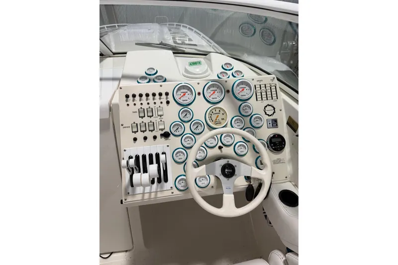 Slide: The Image of Cockpit of 2000 Fountain 47 Lightning boat with gauges and steering wheel. - 3