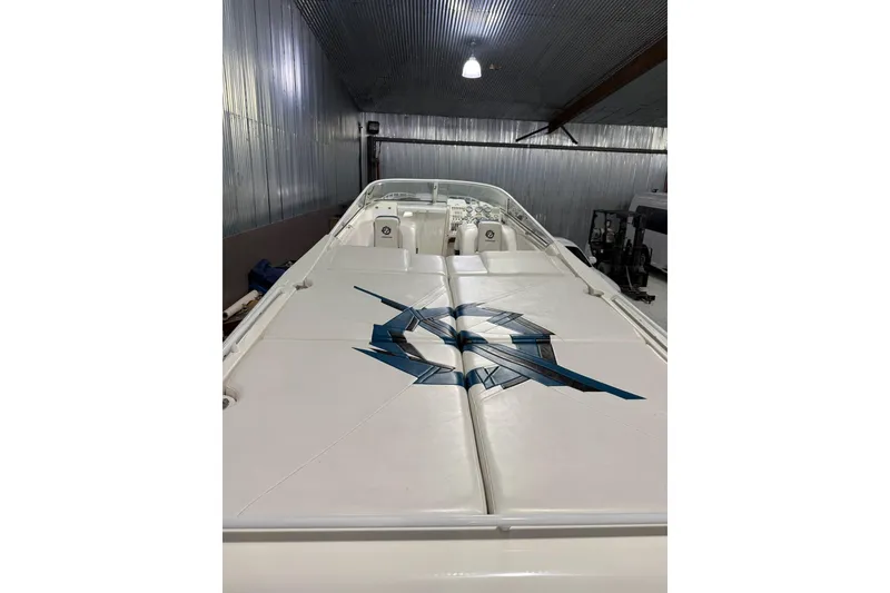 Slide: The Image of 2000 Fountain 47 Lightning boat with sleek design in a metal-walled storage area. - 8