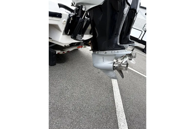 Slide: The Image of 2010 Donzi 29ZF boat with dual outboard motors and stainless steel propellers. - 6
