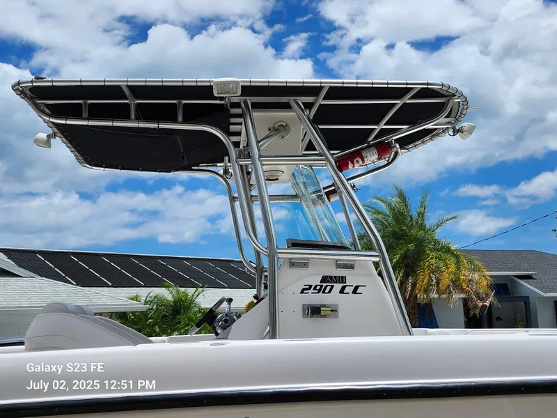 Slide: The Image of 2010 Donzi 29ZF boat with T-top, clear sky background. - 7