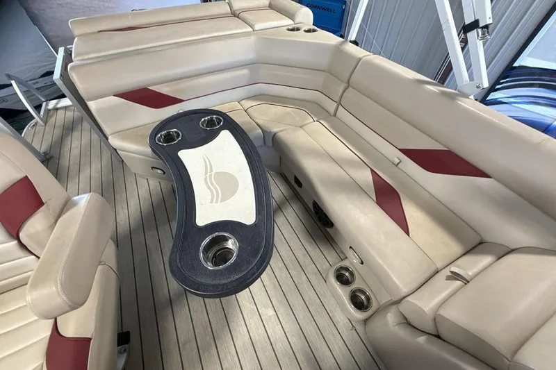 Slide: The Image of Luxurious 2021 SunCatcher Select 20C boat interior with beige seating and stylish table. - 10