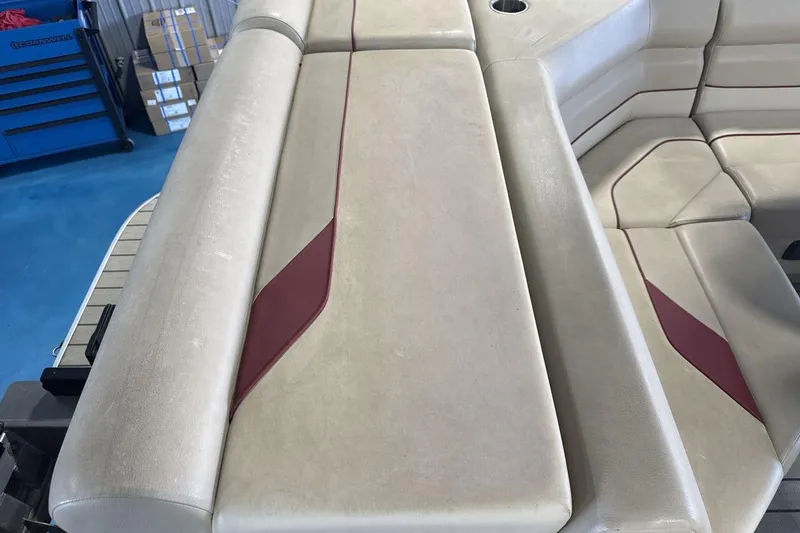 Slide: The Image of SunCatcher Select 20C 2021 boat interior with beige and maroon seating. - 17