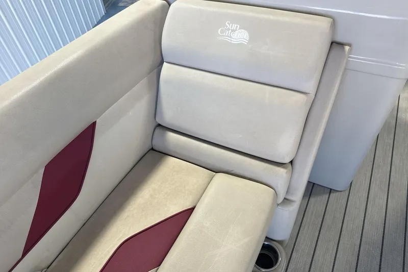 Slide: The Image of SunCatcher Select 20C 2021 boat seat with beige and red upholstery. - 20