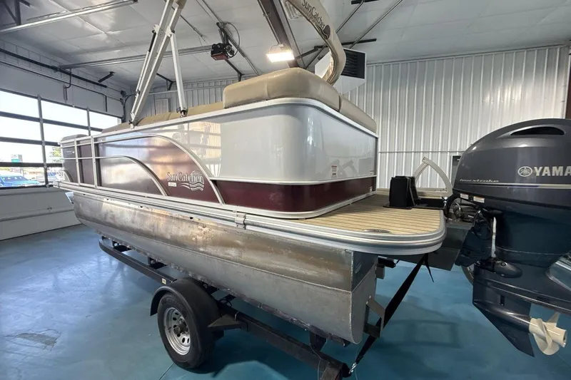 Slide: The Image of 2021 SunCatcher Select 20C pontoon boat with Yamaha motor in a garage setting. - 3