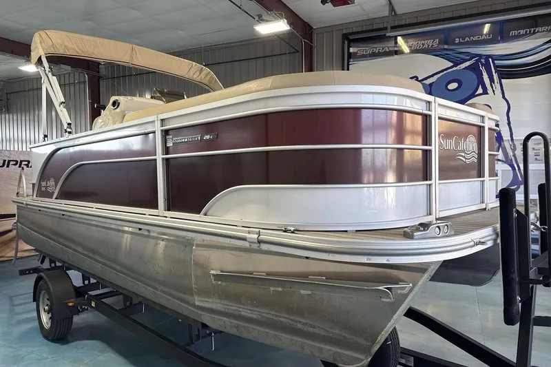 Slide: The Image of 2021 SunCatcher Select 20C pontoon boat in indoor showroom setting. - 7