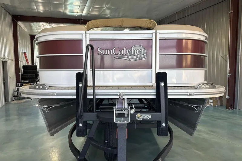 Slide: The Image of 2021 SunCatcher Select 20C pontoon boat in storage facility. - 8