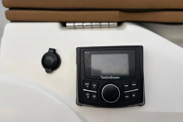 Slide: The Image of Rockford Fosgate audio control panel on 2017 Searay SPX210 boat dashboard. - 12