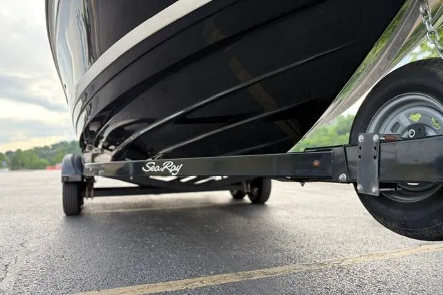Slide: The Image of 2017 Searay SPX210 boat on trailer, close-up view of hull and wheel. - 17