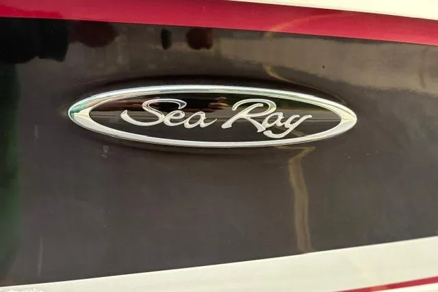 Slide: The Image of 2017 Searay SPX210 boat logo on sleek black and red exterior. - 20