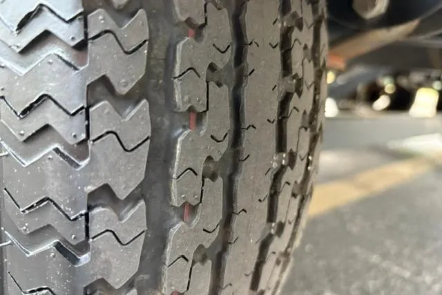 Slide: The Image of Close-up of a 2017 Searay SPX210 tire tread pattern. - 23