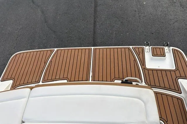 Slide: The Image of 2017 Searay SPX210 boat deck with teak-style flooring and swim platform. - 31