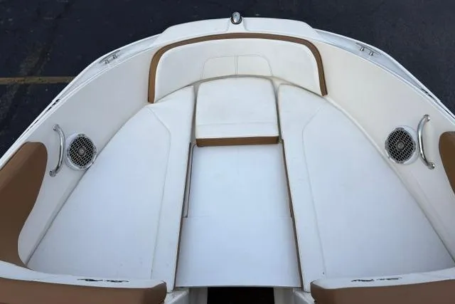 Slide: The Image of 2017 Searay SPX210 boat interior with white and tan seating. - 41