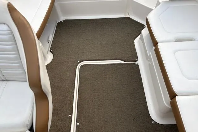 Slide: The Image of 2017 Searay SPX210 boat interior with brown carpet and white seating. - 46