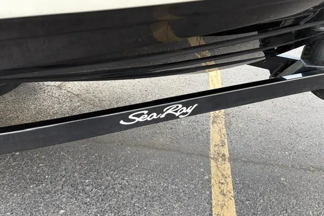 Slide: The Image of 2017 Searay SPX210 boat trailer with Sea Ray logo on pavement. - 62
